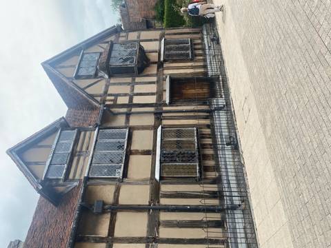       Timber-framed birthplace house of William Shakespeare with leaded windows.
  