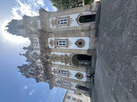       Grand baroque church façade with twin bell towers and ornate stonework
  