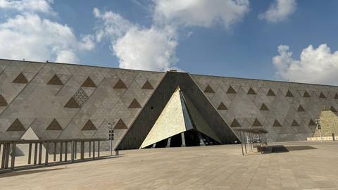       Close view of patterned triangular entrance wall of the Grand Egyptian Museum.
  