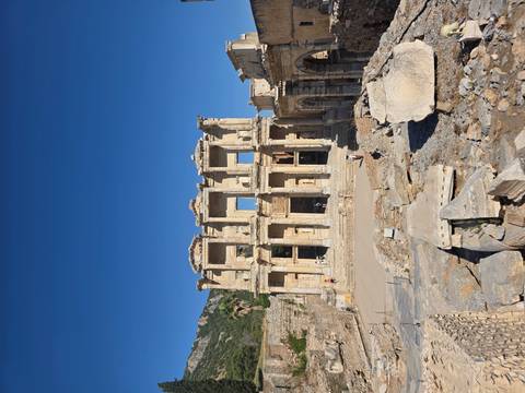       Well-preserved façade of the Library of Celsus in Ephesus under clear sky.
  