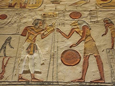       Detailed colorful hieroglyph relief depicting ancient Egyptian figures and symbols
  
