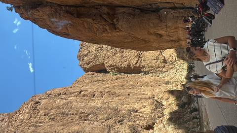       Narrow canyon of Todra Gorge Morocco filled with visitors and motorbikes.
  