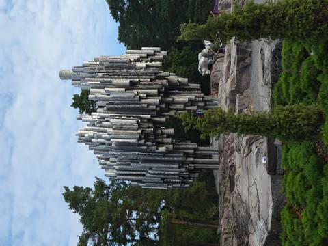       Abstract silver pipes of the Sibelius Monument rising among pine trees in Helsinki.
  
