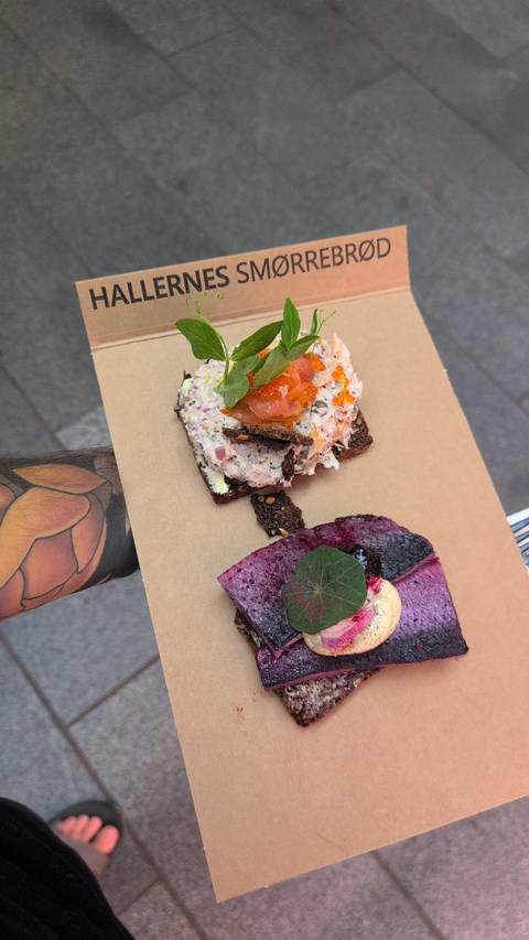       Gourmet Nordic open-faced sandwiches topped with seafood, roe, and herbs served on rye bread.
  