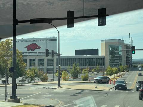       View from a vehicle of Donald W. Reynolds Razorback Stadium and surrounding streets
  