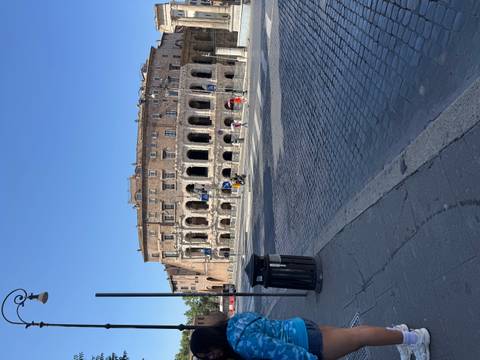       Ancient Roman-era theatre building on a clear blue morning in Rome
  