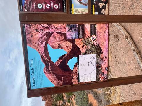       Trailhead information board with map and photo describing the Double Arch Trail.
  