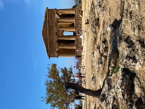       Visitors explore the ancient Temple of Concordia in Agrigento’s Valley of the Temples.
  