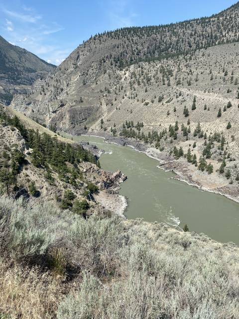       River flowing through rugged terrain.
  