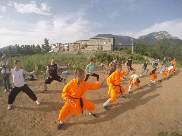 Group practicing martial arts outdoors.