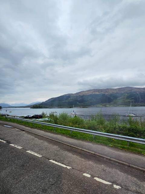 View of a lake with mountains in the background.