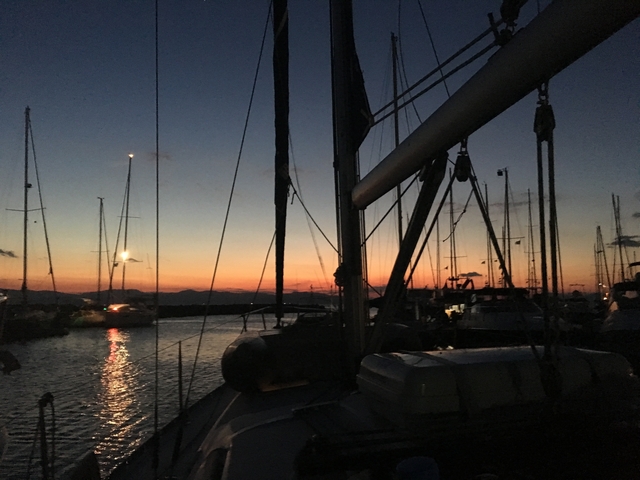       Yachts at a marina during sunset.
  