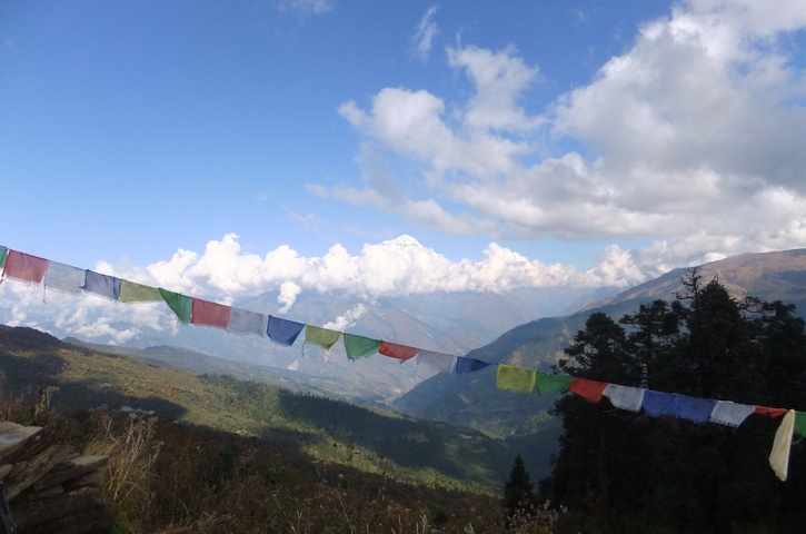 Mountains with prayer flags in the foreground.