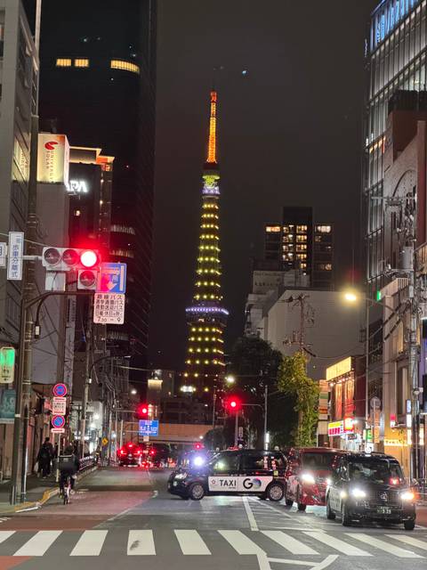 A night scene in Tokyo with the illuminated Tokyo Tower.