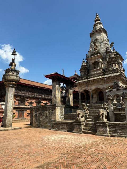 Ancient temple with stone sculptures and blue sky