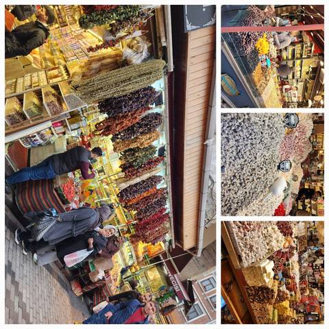 Market scene with various spices and dried goods displayed.