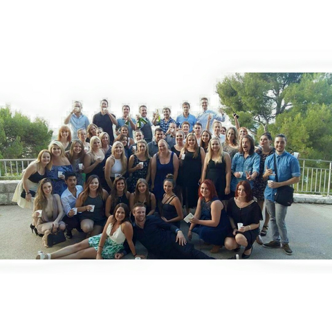 Large group of people dressed up at an outdoor gathering.