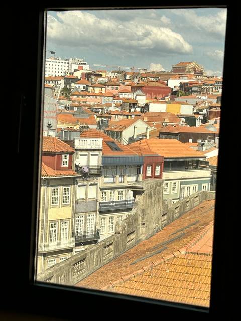 Aerial view of a city with orange rooftops.