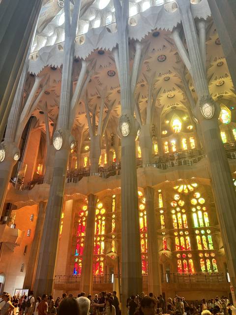 Interior view of La Sagrada Familia with stained glass.