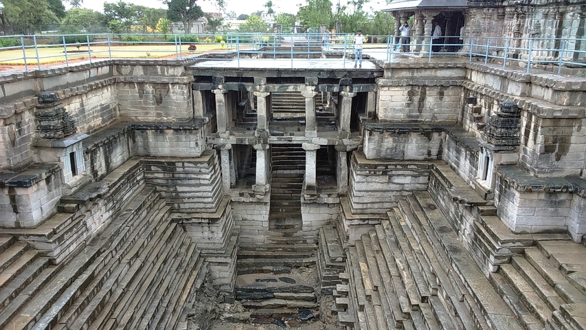       Ancient stepwell with intricate architectural details.
  