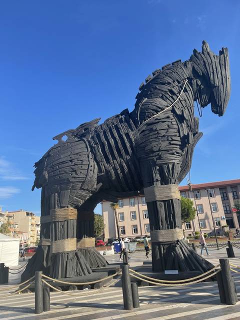 Wooden Trojan Horse replica under a blue sky.