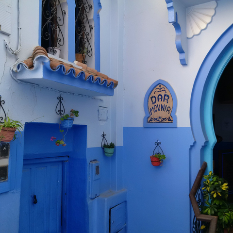 Charming blue and white building exterior in Chefchaouen.