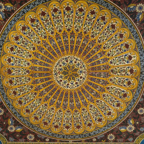 Intricate Islamic geometric pattern in vibrant colors.