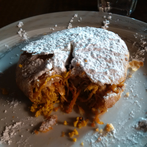 Traditional Moroccan dish with powdered sugar topping.