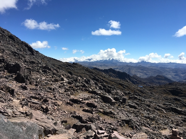 Rocky mountain landscape with a clear, expansive sky.