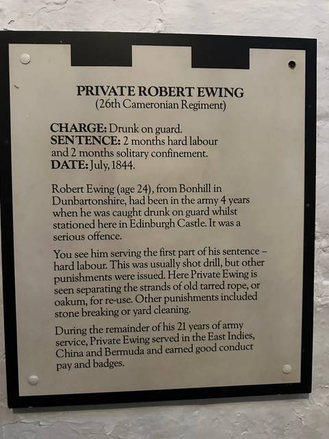       Text on a plaque describing Private Robert Ewing's offense and punishment.
  