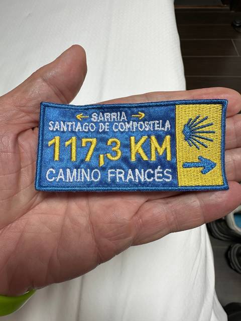       Close-up of a commemorative patch for the Camino Frances.
  