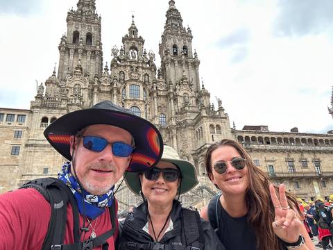 Group selfie with the cathedral backdrop.
