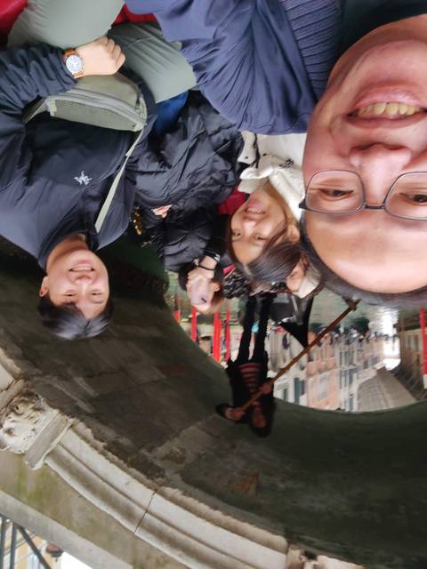       Outdoor gondola ride with friends on a canal.
  