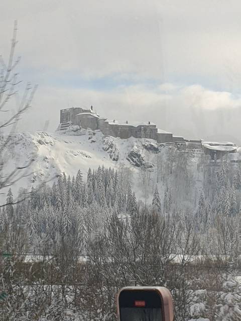       Snowy mountain fortress view.
  