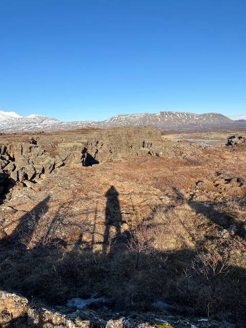       Landscape with mountains and distant snow.
  