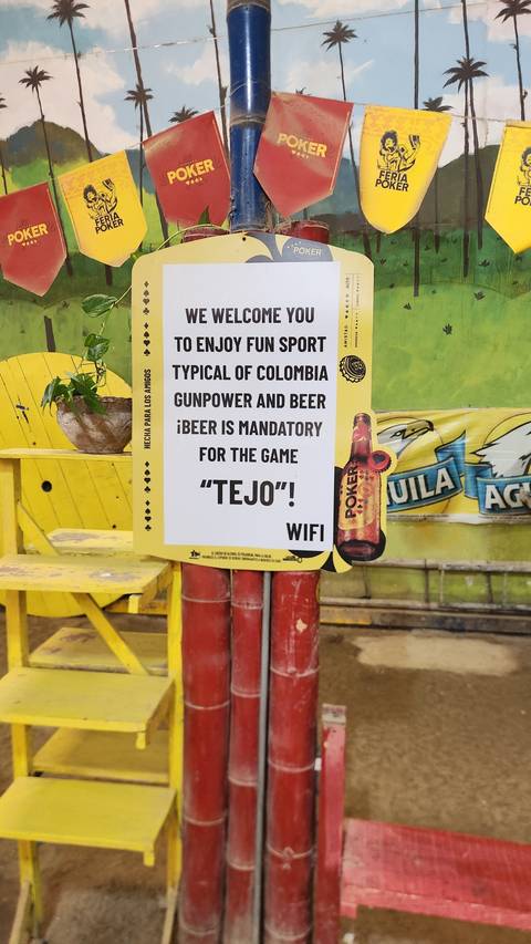       Sign promoting a local sport and drinks.
  