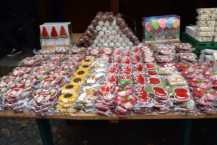 Display of various decorated cookies and sweets on a table.