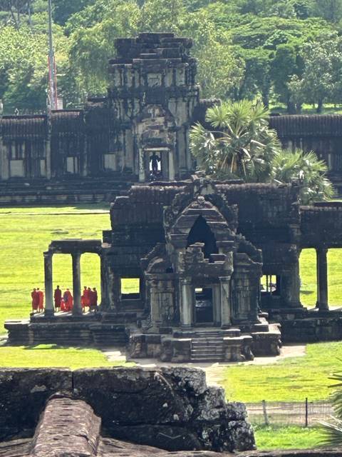 Ancient temple ruins with monks.