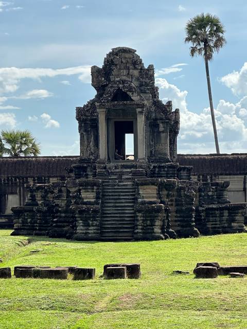       Facade of an ancient temple with clear blue sky.
  