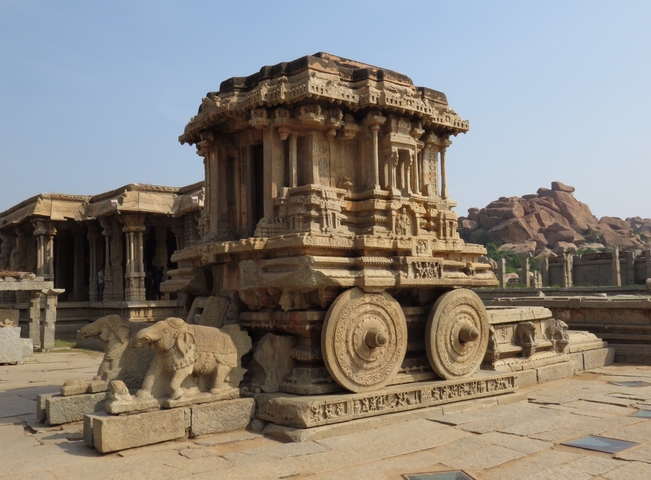       Ancient stone chariot temple structure in a historic site.
  