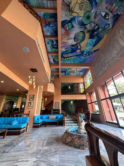 Indoor colorful mural with abstract designs.