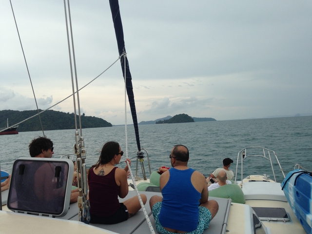 People on a boat sailing at sea.