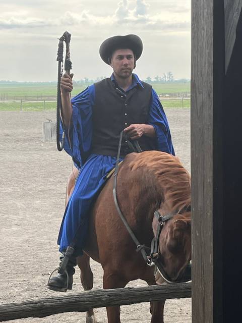 Man riding a horse in traditional attire