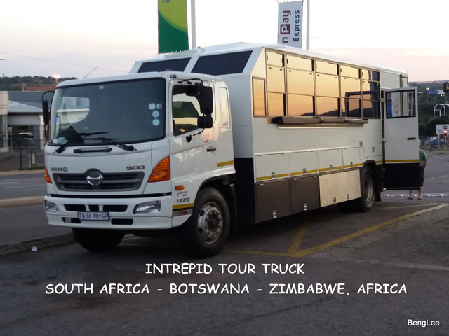       Tour truck parked with text overlay.
  