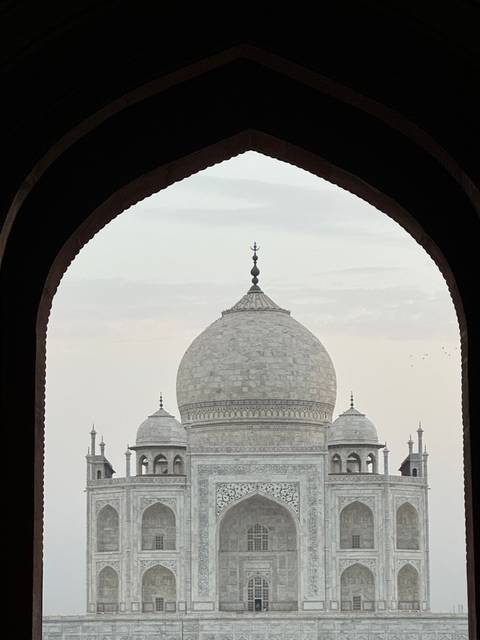 Close-up of the Taj Mahal framed by an archway.