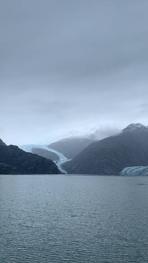 Body of water with mountainous terrain in the background.