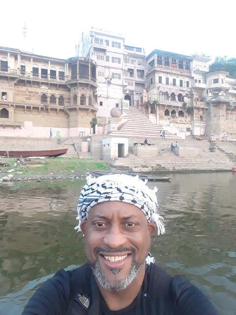       A man's head with historical buildings in the background.
  
