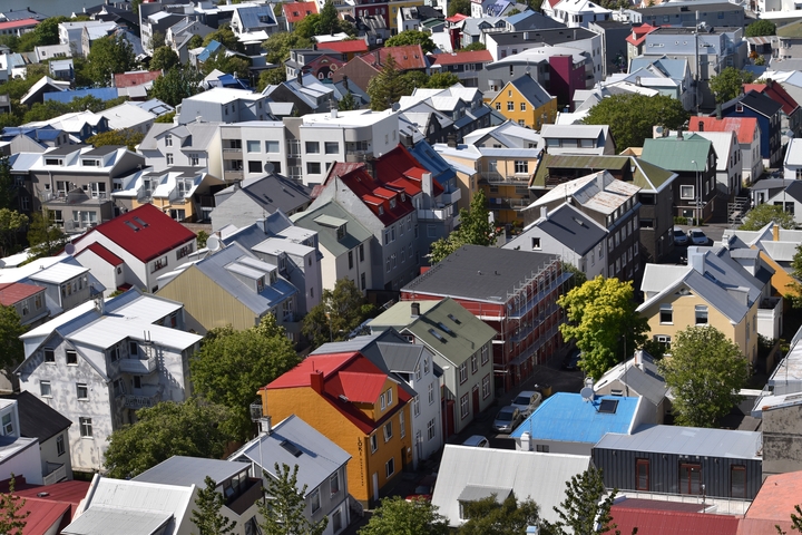       Aerial view of colorful houses in a city.
  