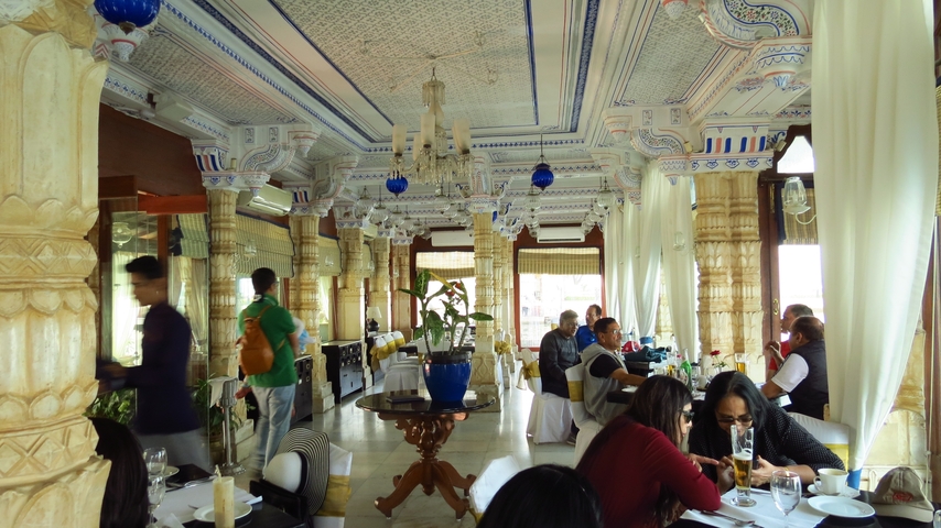       People dining in an ornately decorated restaurant.
  