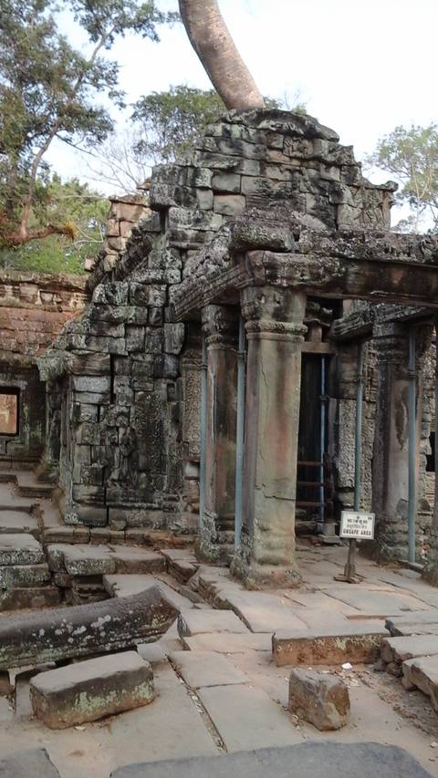       Ancient temple ruins with carved stone pillars.
  